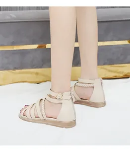 Detail view of Bohemian beige braided gladiator sandals featuring a heel zipper closure
