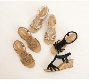 Detailed overhead view of wedge sandals with rhinestone leaf patterns in multiple colors