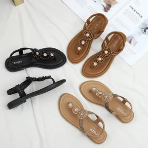 Bohemian style flat sandals with beaded flowers and elastic back strap in multi colors