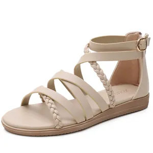 Bohemian beige strappy flat sandals for women featuring woven roman style crisscross bands