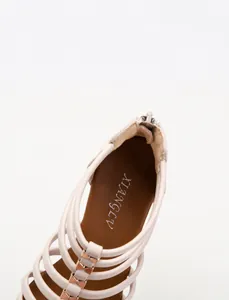 Detail showing the comfortable latex midsole and soft PU leather straps of the wedge sandal