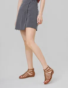 Close-up of brown multi-strap roman gladiator sandals with casual wedge heel design