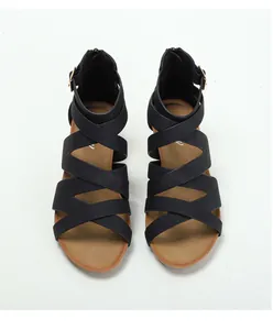 Overhead shot of black Roman gladiator sandals with multi-strap design and brown insoles