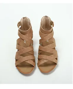 Top view of brown gladiator sandals with cross-straps and back zipper detail