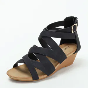 Classic black strappy wedge sandals with wood-grain heel and gold buckle closure