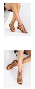 Detail view of brown gladiator sandals with metal studs and flat non-slip rubber soles