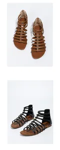 Detail of bohemian flat gladiator sandals with metallic rivets and rear zipper closure