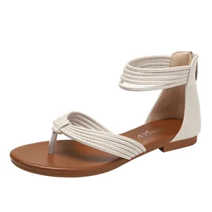 Stijlvolle beige platte gladiator sandalen met meerdere bandjes en teenlus ontwerp