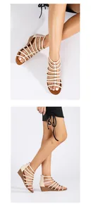 Detail of beige gladiator wedge sandals featuring multiple straps and metallic studs