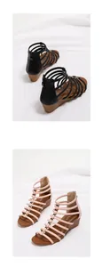 Detail view of pink and black wedge sandals featuring wood-grain heels and gold metal buckles
