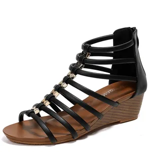 Bohemian black wedge sandals with gold diamond accents and gladiator straps
