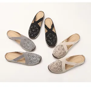 Detail of glitter geometric pattern and elastic straps on women slip-on mule sneakers