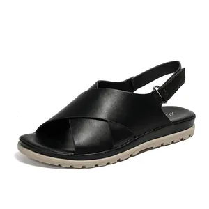 Black cross strap flat sandals for women featuring adjustable heel strap and anti-slip sole