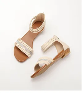 Detail of wedge sandals with ruffled straps and sparkling rhinestones for women