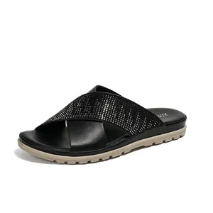 Sandalias negras para mujer con tiras cruzadas de strass y suela de plataforma beige
