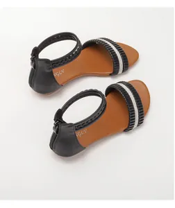 Close-up of black pleated leather wedge sandals with sparkling silver rhinestone trim