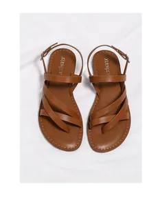Top view of brown strappy flat sandals with adjustable heel buckles on white cloth