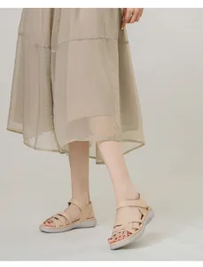 Women's beige wedge sandals with cross weave straps and comfortable thick soles