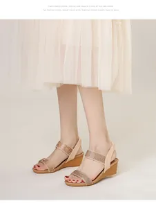 Detail of bohemian wedge sandals featuring sparkling rhinestone straps and wood grain heels