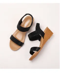 Detail view of Bohemian wedge sandals featuring rhinestone straps and wood-grain textured heels