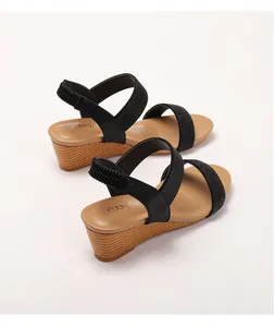 Close-up of bohemian wedge sandals featuring rhinestone straps and non-slip cork soles