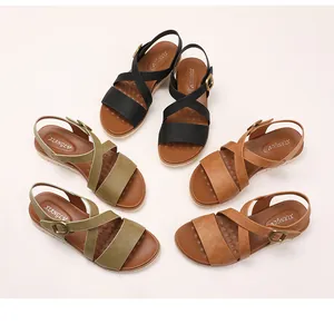 Flat wedge sandals in black, olive, and brown with cross straps and massage footbed