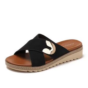 Bohemian platform sandals with black crisscross straps and golden metal buckle decor