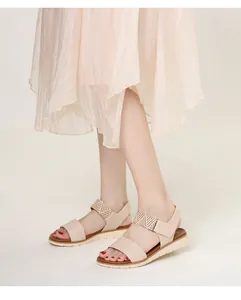 Detail of wedge sandals showing non-slip white outsole and comfortable braided ankle strap