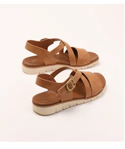 Close-up of camel crisscross wedge sandals with adjustable buckle and non-slip sole