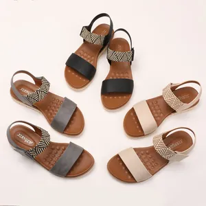 Women's wedge sandals in black, grey, and beige featuring woven straps and massage footbeds