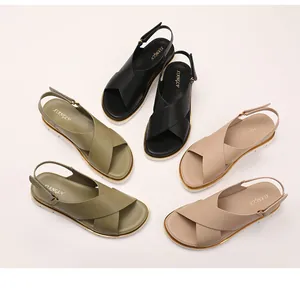 Flat sandals with wide criss-cross straps in black, olive green, and beige colors