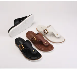 Macro detail of flip-flops with metallic buckle decorations and non-slip platform soles