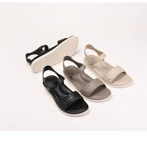 Detail view of anti-slip rubber soles and three color options for women's flat sandals