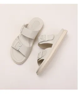 Detail of double buckle platform sandals featuring breathable footbed and anti-slip sole