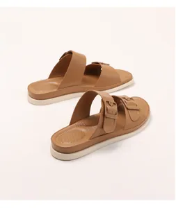 Detail of brown double-strap slippers with arch support and thick anti-slip sole
