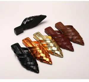 Detailed view of pointed toe woven mule slippers in various colors and metallic finishes