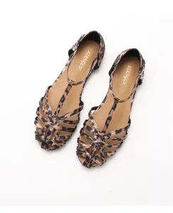 Top view of hollow woven leopard print flat sandals with adjustable T-strap buckles
