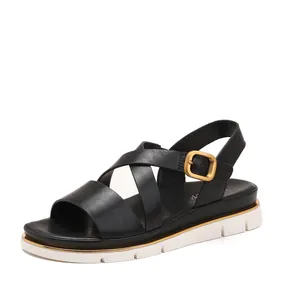 Women's wedge sandals with black leather crossover straps and gold buckles for summer