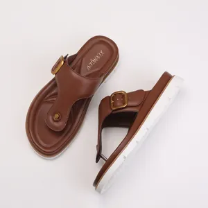 Brown leather thong sandals for women with thick non-slip platform and gold metal buckle