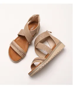 Detail of woven khaki wedge sandals featuring rhinestone accents and non-slip platform sole