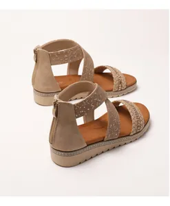Detail of khaki wedge sandals featuring rhinestone woven straps and star print elastic bands