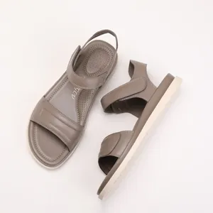 Mocha brown flat sandals for women featuring thick soles and adjustable velcro straps
