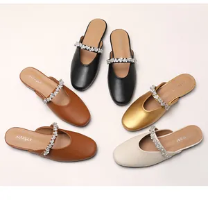 Flat mules with rhinestone straps in black, brown, gold, and apricot colors