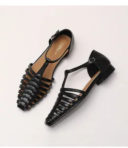 Top view of black woven T-strap leather sandals with vintage hollow out cage design