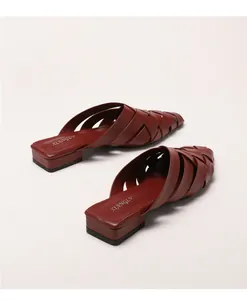 Close-up of burgundy woven leather upper on pointed toe block heel mule shoes
