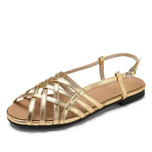 Chic gold strappy flat sandals with Roman woven texture and adjustable heel strap