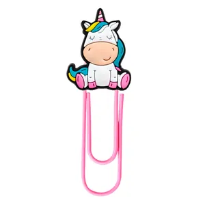 Close-up of a pink paperclip with a cute cartoon silicone unicorn decorative head