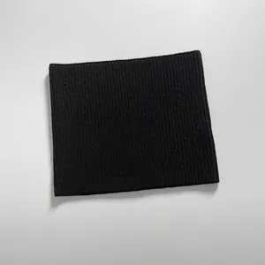 Detailed flat lay of black ribbed knit neck warmer showing elastic texture and stitching