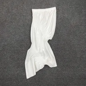 Detail shot of white smocking fabric texture with elastic pleated smocked design