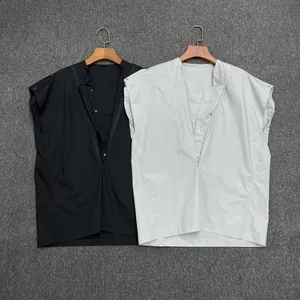 Minimalist V-neck sleeveless shirts in black and grey hanging on wooden hangers